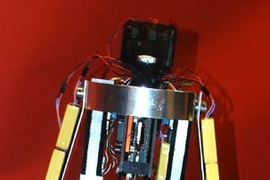 'Toddler,' a walking robot developed at MIT, takes a step.