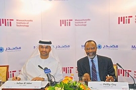 Abu Dhabi Future Energy Company CEO Sultan Al Jaber, left, and MIT Chancellor Phillip Clay prepare to sign the cooperative agreement.
