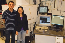 Research Laboratory of Electronics graduate students Vitor Manfrinato and Lin Lee Cheong, with the electron-beam lithography system they used in their experiments.