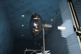 View of a CubeSat equipped with an inflated antenna, in a NASA radiation chamber.