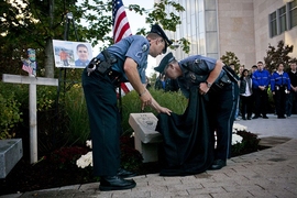 MIT Police officers unveil the new memorial to Officer Sean Collier.