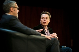 Jaime Peraire, left, AeroAstro department head and H.N. Slater Professor of Aeronautics and Astronautics, speaks to Elon Musk, CEO and co-founder of SpaceX and Tesla. 