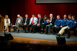 MIT AeroAstro professor Dava Newman (left) moderates a Q&A session with MIT professor Jeffrey Hoffman and MIT alumni astronauts, including (in alphabetical order) Dominic Antonelli, Kenneth Cameron, Christopher Cassidy, Catherine Coleman, Franklin Chang-Diaz, E. Michael Fincke, Jack Fischer, John Grunsfeld, and Michael Massimino.
