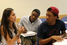 Members of the Geometers team (from left) Tiffany Buman, Evan Fenton and Trajan Hammonds, confer on a problem. 