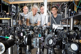 The Ketterle Group is working with lasers to create superfluids at MIT. Pictured, from left to right: grad student Colin Kenned, Professor Wolfgang Ketterle, grad student William Cody Burton, and grad student Woo Chang Chung.