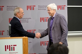 MIT President L. Rafael Reif (left) opened the MIT press conference and congratulated Holmström.
