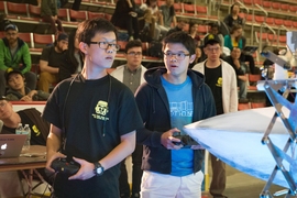 Sophomore ZhiYi Liang (left) and freshman second/driver Gabriel Li, (right) compete in the 2017 MIT Mechanical Engineering 2.007 Student Design Final Robot Competition. Liang would go on to place fourth in the competition.