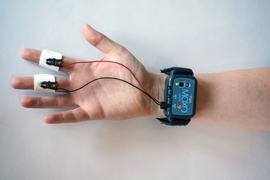 mPath's MOXO sensor, used primarily for market research, is a wearable that resembles a bulky smartwatch. Placed on the wrist, it wirelessly measures changes in skin conductance (subtle electrical changes across the skin), which reflect sympathetic nervous system activity and physiological arousal. Spikes in conductance can signal stress and frustration, while dips may indicate disinterest or bore...