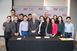 MIT Associate Provost Richard Lester, center left; MIT associate professor Siqi Zheng, the founding faculty member of the China Future City Lab, center right; along with MIT staff and researchers, at the lab's launch event, November 17, 2017.