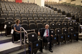Gerald Fink chats with an early arrival to the Killian Lecture, held in MIT’s Room 10-250.
