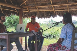 Eduardo Undurraga, an assistant professor at the Pontifical Catholic University of Chile, runs a musical pitch perception experiment with a member of the Tsimane’ tribe of the Bolivian rainforest.