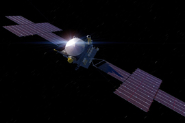 Psyche floats in space, with large solar panels on both sides.