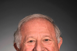 Headshot of Ed Roberts with a gray background.
