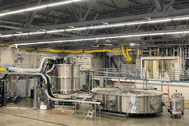 Large cryostat setup, resembling chrome-plated vats, inside MIT’s Plasma Science and Fusion Center