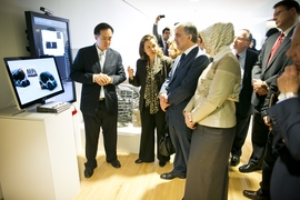 Turkish president Abdullah Gul (center) listens to a presentation on electric vehicles in the MIT Media Lab.
