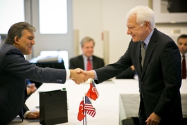 Turkish president Abdullah Gul (left) greets MIT Vice President Claude Canizares (right) in MIT's Building 10 on May 30.
