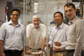 Scientists in the Essigmann lab — (left to right) Vipender Singh, John Essigmann, Deyu Li, and Bogdan Fedeles — scrutinize the structure of the DNA double helix, as they investigate the mechanism of mutagenesis of KP1212.