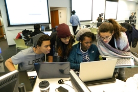 (Left to right) Kevin White, a junior biology major from Howard University; Sheena Vasquez, a junior biology major from Georgia Perimeter College; Candace Ross, a senior computer engineering major from Howard University; and Paloma Sanchez-Jauregui, a neuroscience major from the University of Puerto Rico, brainstorm on a Python module.
