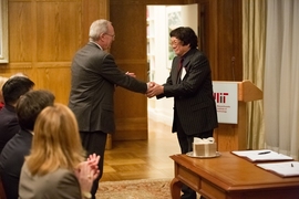 MIT President L. Rafael Reif shakes hands with Samuel Tak Lee at the signing ceremony formalizing Lee's gift to MIT. The gift will create a new Samuel Tak Lee MIT Real Estate Entrepreneurship Lab and result in the renaming of MIT's Building 9 as the Samuel Tak Lee Building.