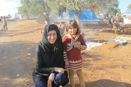 Christia visits Syrian internally-displaced children in a camp in December 2012.