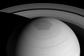 The rings of Saturn and its north polar vortex.
